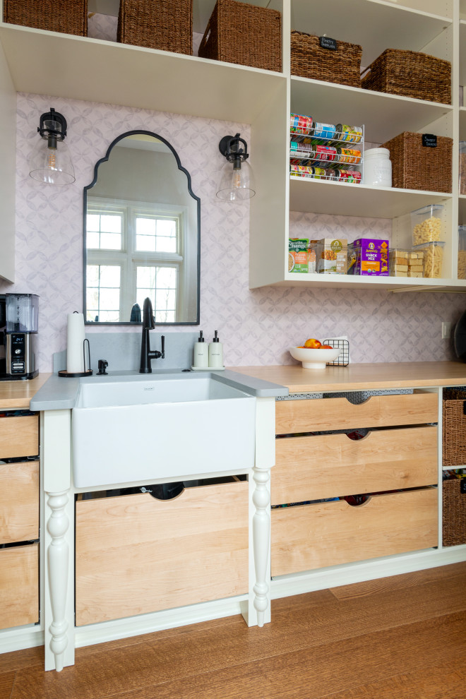 Inspiration for a large medium tone wood floor and exposed beam eat-in kitchen remodel with white backsplash, stainless steel appliances and an island