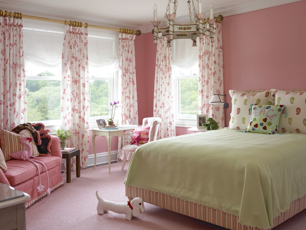This is an example of a mid-sized traditional kids' bedroom for girls in New York with pink walls.
