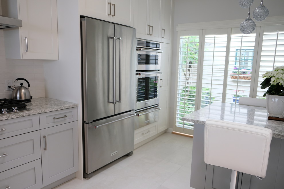 Example of a transitional kitchen design in Vancouver