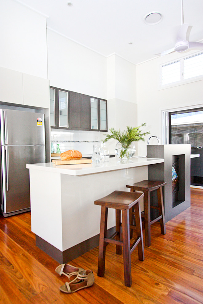 Inspiration for a beach style galley kitchen in Brisbane with stainless steel appliances.