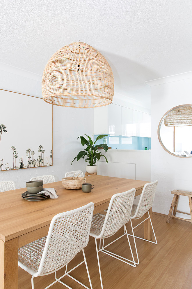 Inspiration for a beach style dining room in Brisbane.