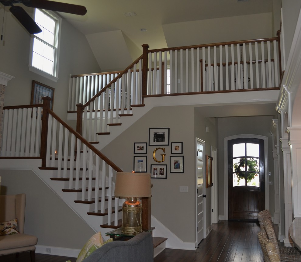 Inspiration for a mid-sized transitional wooden staircase remodel in Nashville with wooden risers