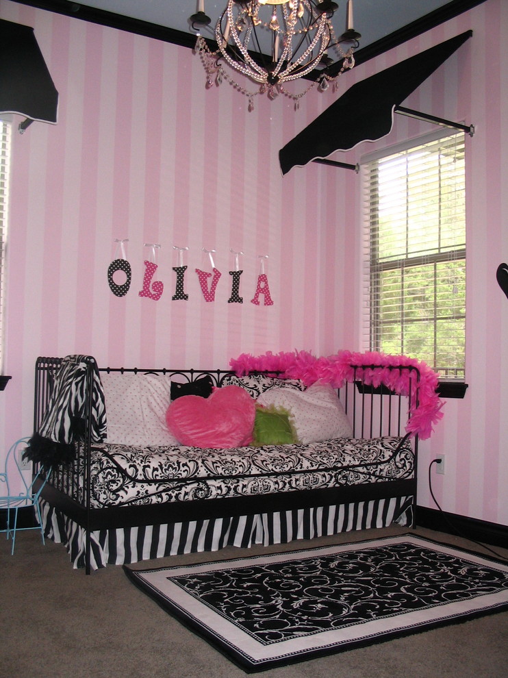 Inspiration for a small traditional kids' room for girls in Austin with pink walls and carpet.