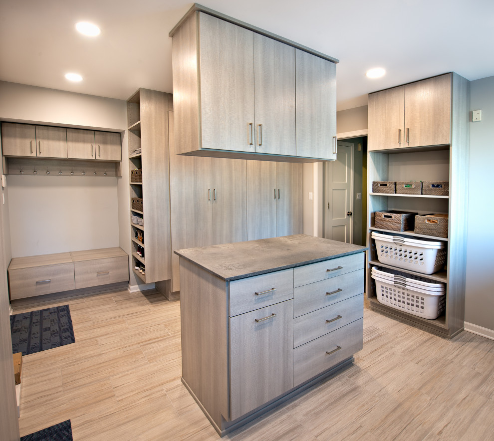 Design ideas for a contemporary utility room in Chicago with an utility sink, flat-panel cabinets, distressed cabinets, concrete benchtops, blue splashback, glass tile splashback, grey walls, ceramic floors, a side-by-side washer and dryer, grey floor and grey benchtop.