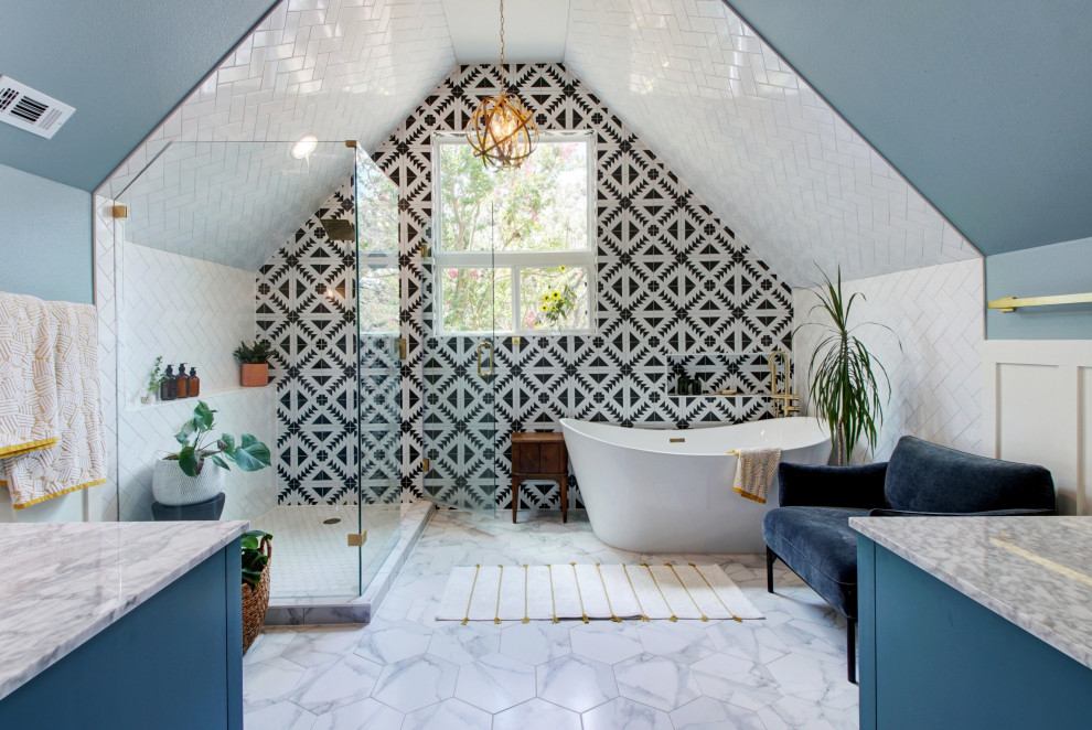 Transitional black and white tile white floor freestanding bathtub photo in Austin with blue cabinets, blue walls, a hinged shower door and gray countertops