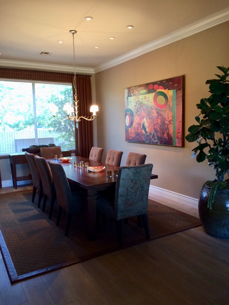 Photo of a large transitional separate dining room in Phoenix with beige walls, light hardwood floors and no fireplace.