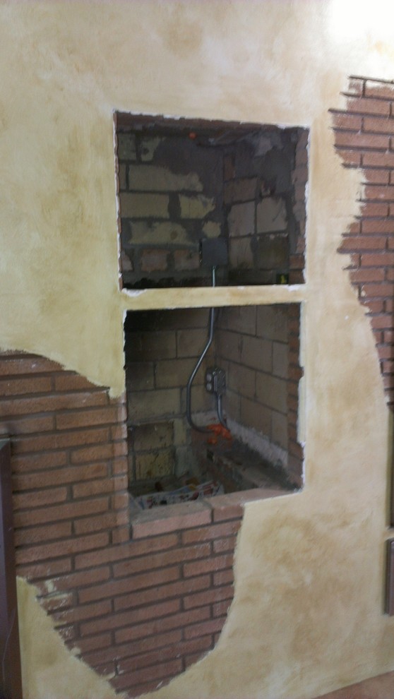 Any creative ideas for this hole in kitchen wall?
