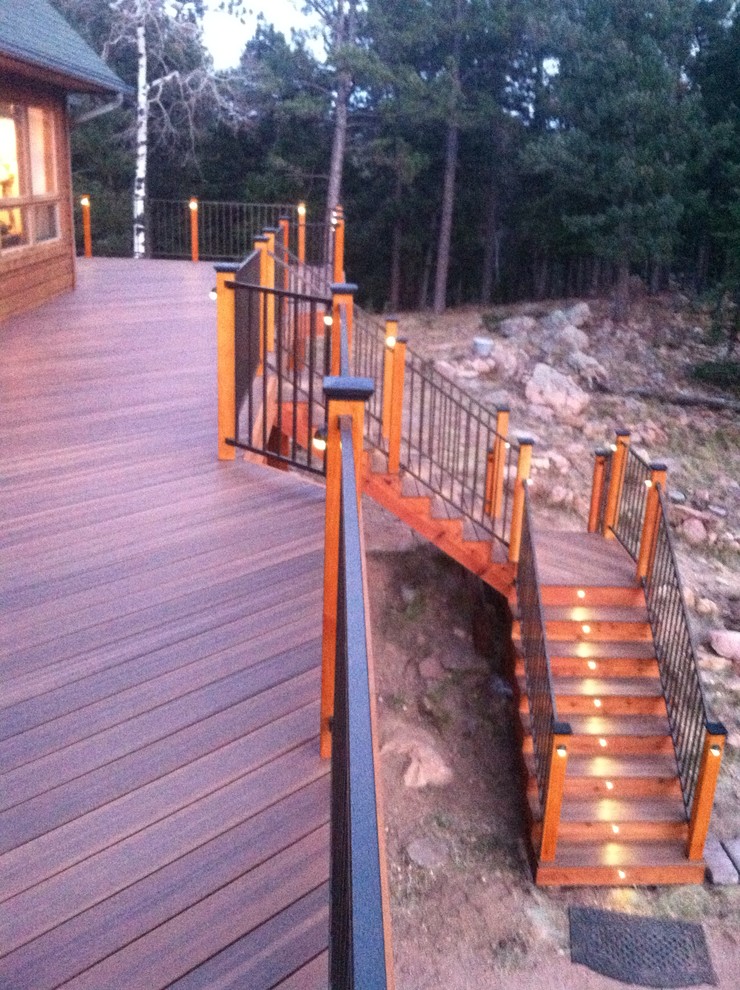 Inspiration for a large arts and crafts backyard patio in Denver with decking and no cover.
