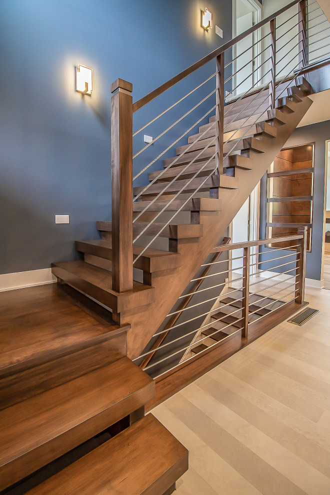 Источник вдохновения для домашнего уюта: огромная деревянная лестница в стиле рустика с деревянными ступенями, деревянными перилами и любой отделкой стен