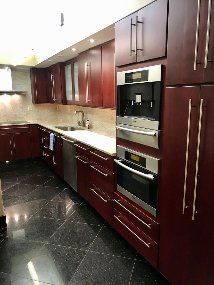 This is an example of a small mediterranean galley eat-in kitchen in Other with flat-panel cabinets, dark wood cabinets, granite benchtops, multi-coloured splashback, granite splashback, stainless steel appliances, marble floors, with island, black floor and multi-coloured benchtop.