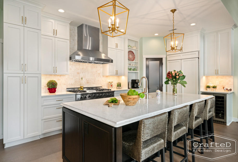 Inspiration for a large traditional u-shaped separate kitchen in Seattle with an undermount sink, recessed-panel cabinets, white cabinets, quartz benchtops, beige splashback, ceramic splashback, stainless steel appliances, linoleum floors, with island, brown floor and white benchtop.