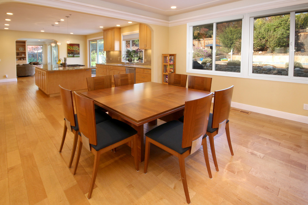This is an example of an expansive traditional kitchen/dining combo in San Francisco with light hardwood floors.