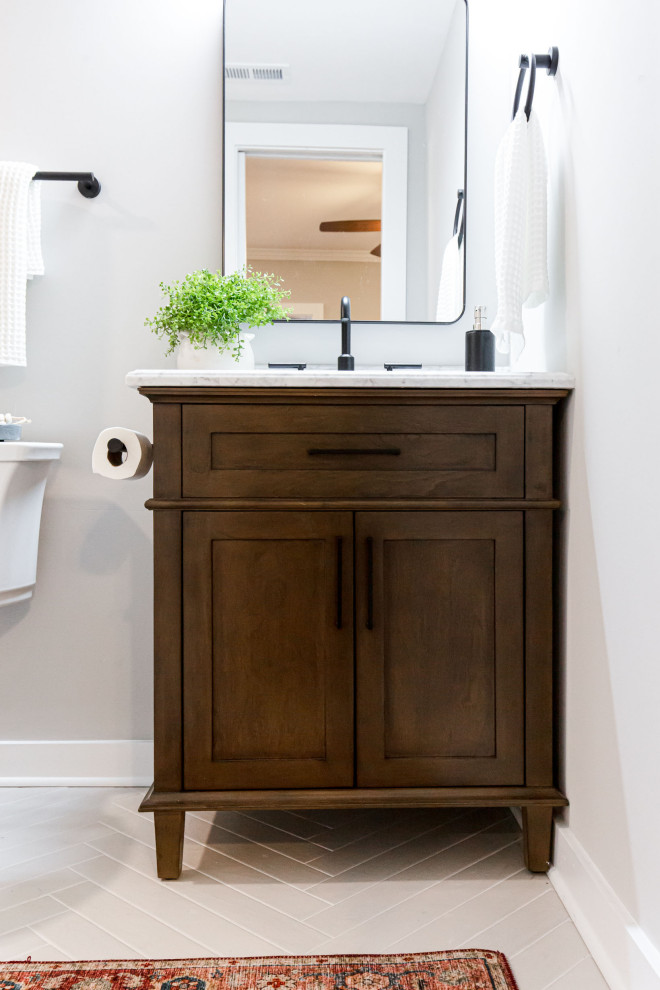 Inspiration for a small contemporary kids bathroom in Atlanta with shaker cabinets, dark wood cabinets, an alcove shower, white tile, subway tile, porcelain floors, marble benchtops, white floor, a hinged shower door, a niche, a single vanity and a freestanding vanity.