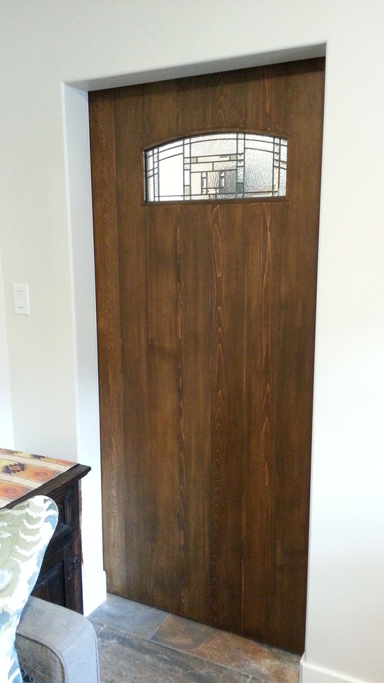 Photo of a mid-sized country entryway in Edmonton with beige walls and medium hardwood floors.
