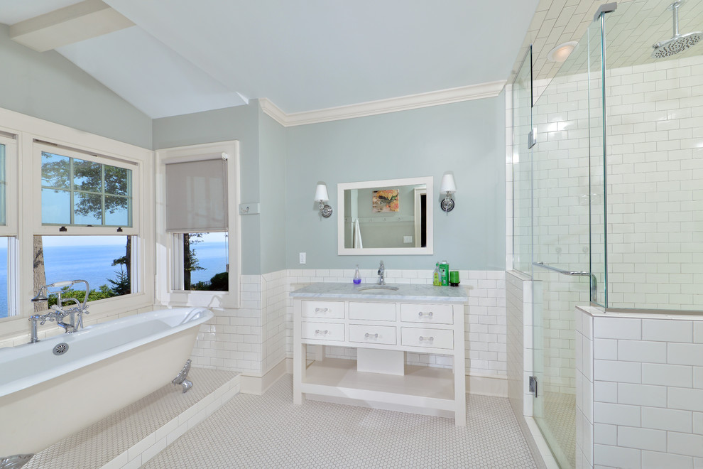 Design ideas for a traditional bathroom in Cleveland with a freestanding tub and subway tile.