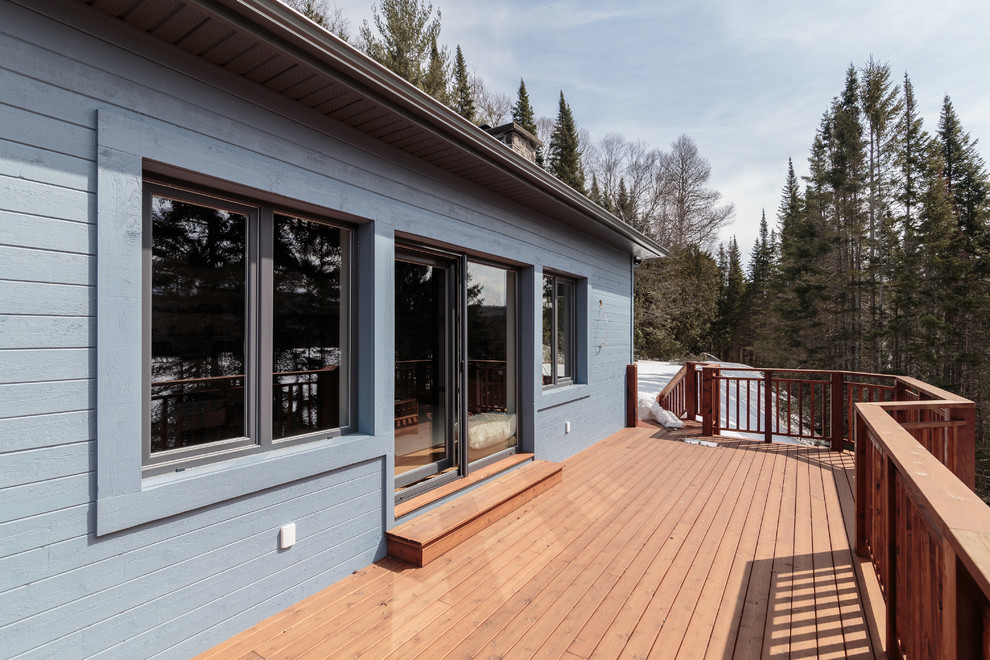 Photo of an expansive transitional backyard deck in Montreal with no cover.
