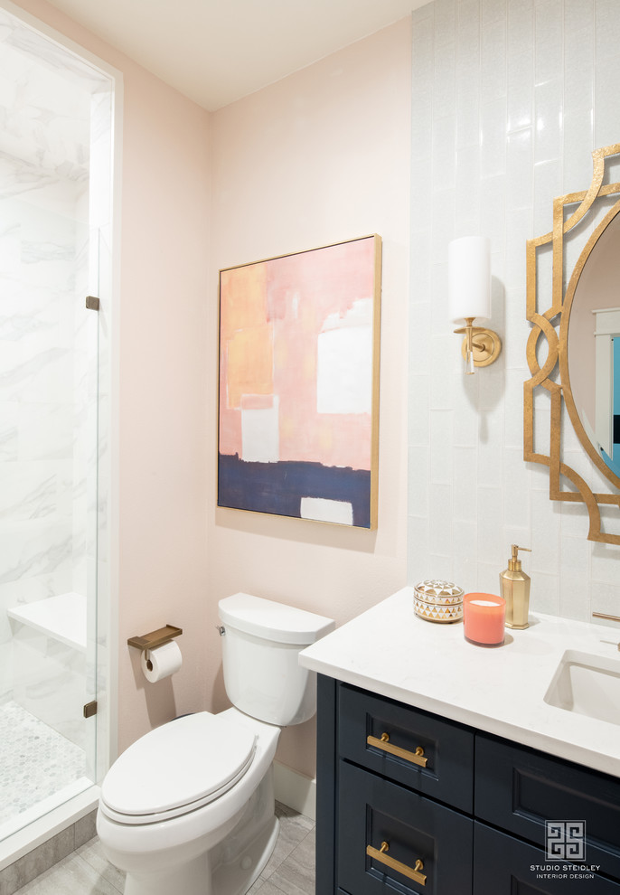 Mid-sized asian 3/4 bathroom with beaded inset cabinets, blue cabinets, an open shower, blue tile, glass tile, pink walls, light hardwood floors, an undermount sink, quartzite benchtops, brown floor, a hinged shower door and white benchtops.