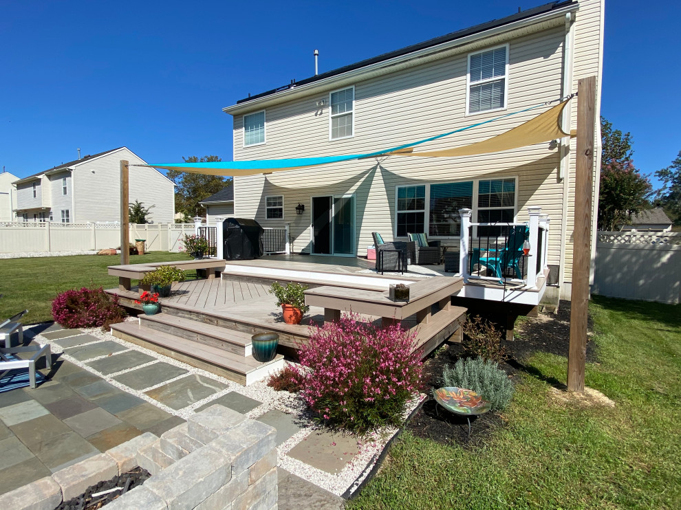 Example of a large classic backyard deck design
