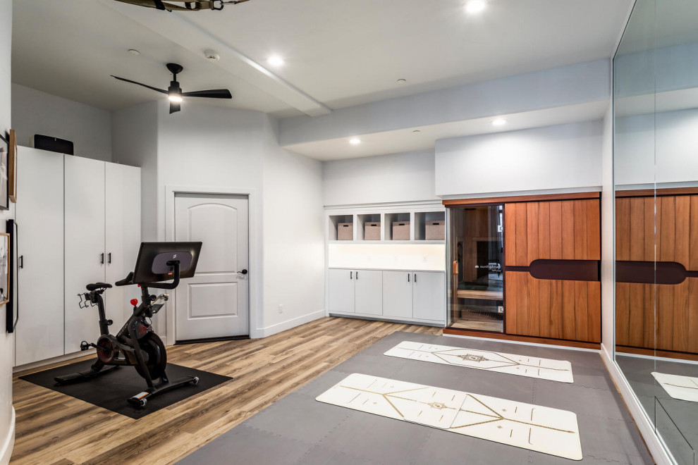 Inspiration for a mid-sized contemporary multipurpose gym in Salt Lake City with white walls, vinyl floors and beige floor.