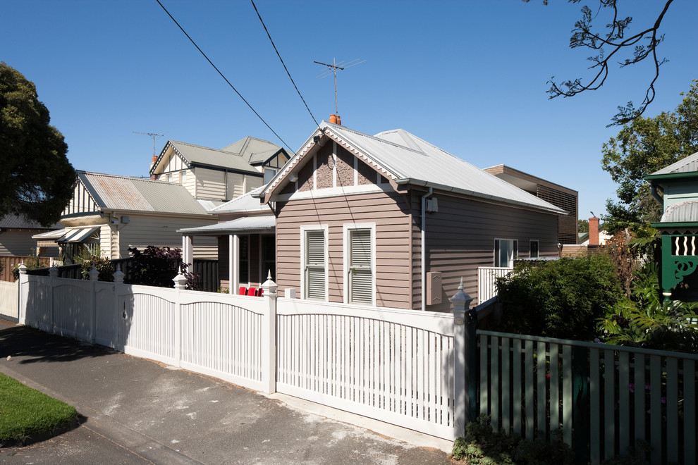 Design ideas for a mid-sized contemporary two-storey exterior in Melbourne with wood siding.