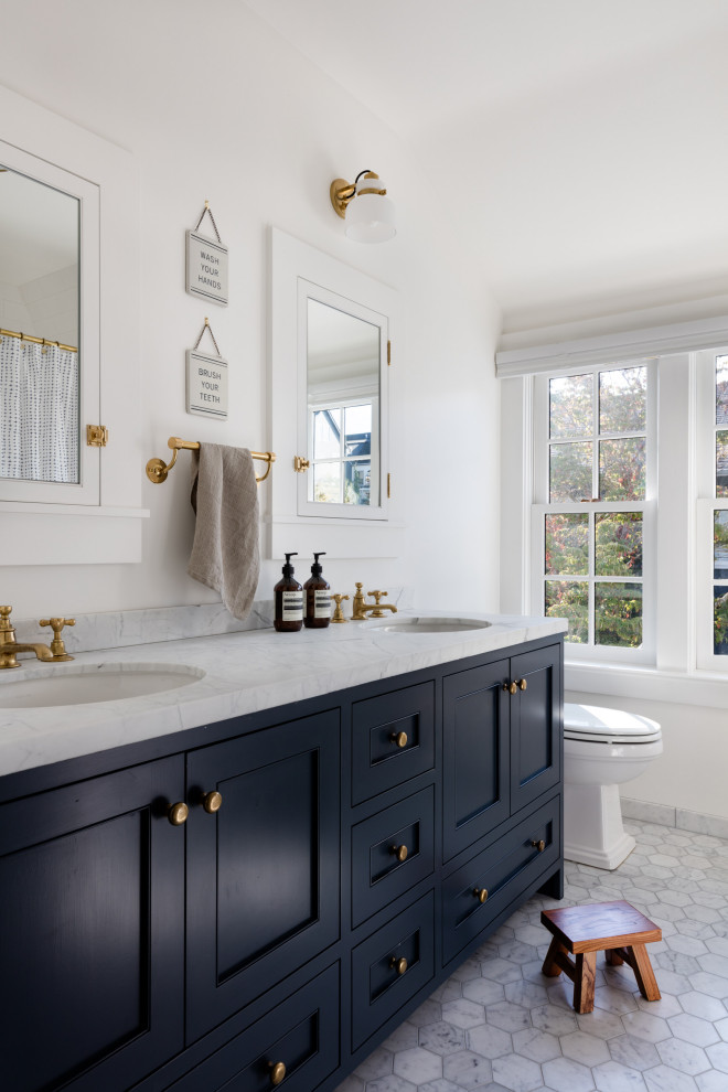 Inspiration for a transitional kids' gray floor and double-sink bathroom remodel in Seattle with recessed-panel cabinets, blue cabinets, white walls, an undermount sink and white countertops
