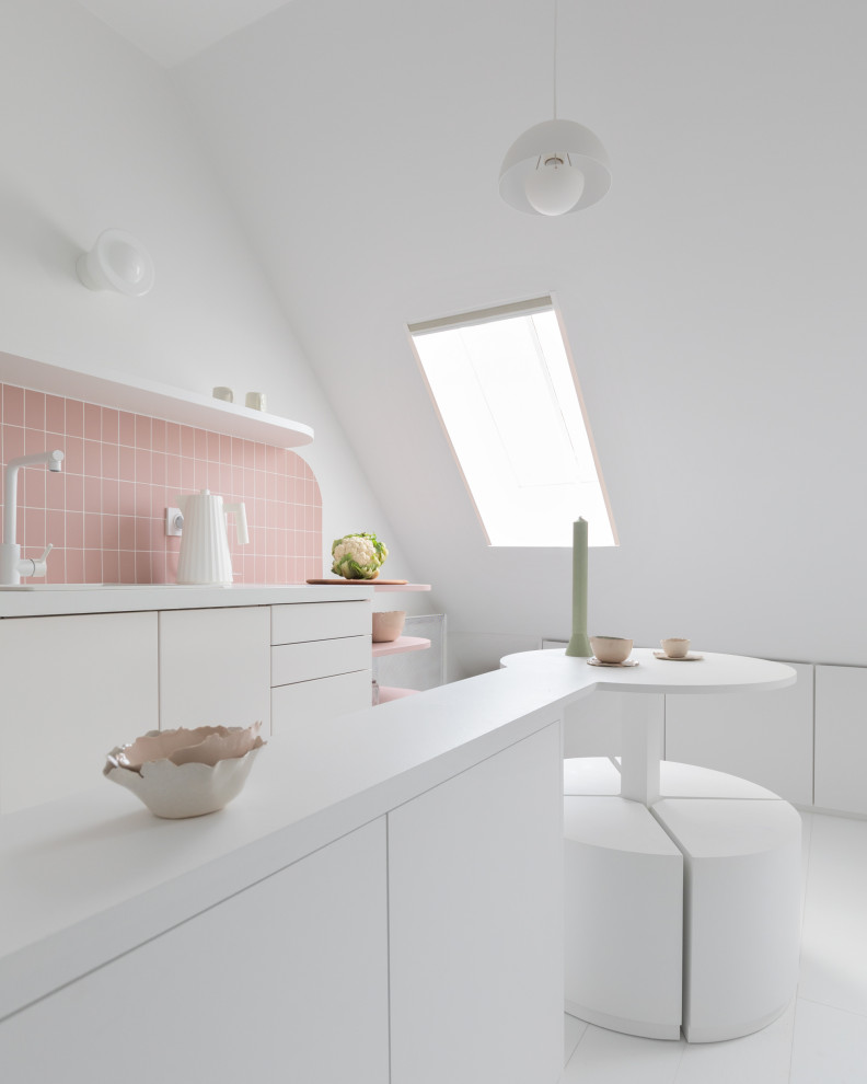 Photo of a small single-wall eat-in kitchen in Paris with a single-bowl sink, beaded inset cabinets, white cabinets, laminate benchtops, pink splashback, ceramic splashback, white appliances, painted wood floors, with island, white floor and white benchtop.