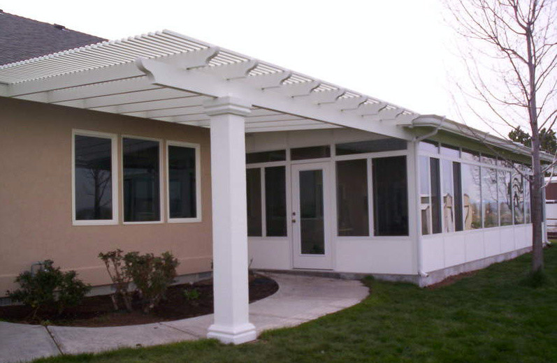 Deck - small transitional side yard deck idea in Boise with a roof extension