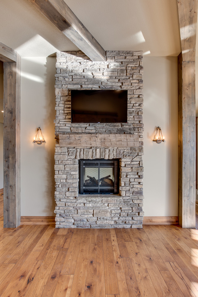 Huge mountain style u-shaped medium tone wood floor eat-in kitchen photo with a farmhouse sink, beaded inset cabinets, beige cabinets, granite countertops, beige backsplash, mosaic tile backsplash, stainless steel appliances and an island
