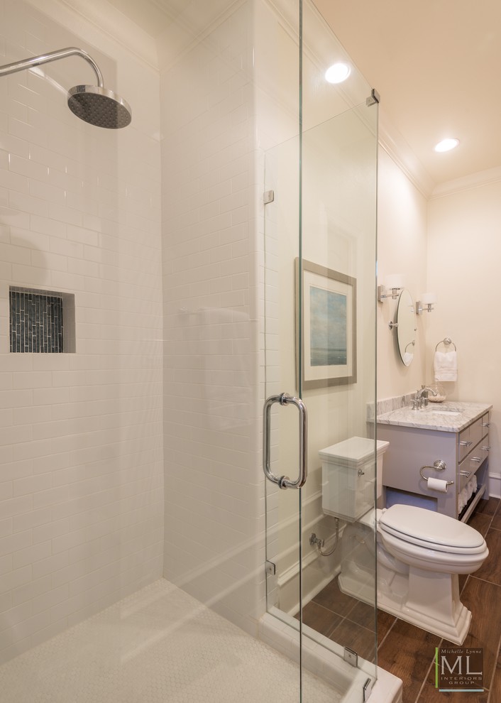 Design ideas for a large transitional 3/4 bathroom in Dallas with glass-front cabinets, yellow cabinets, a corner shower, a two-piece toilet, gray tile, white walls, ceramic floors, a drop-in sink and engineered quartz benchtops.