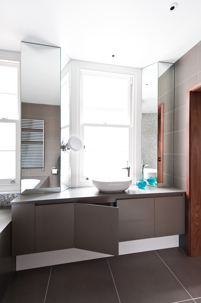 Contemporary bathroom in Other with a vessel sink.