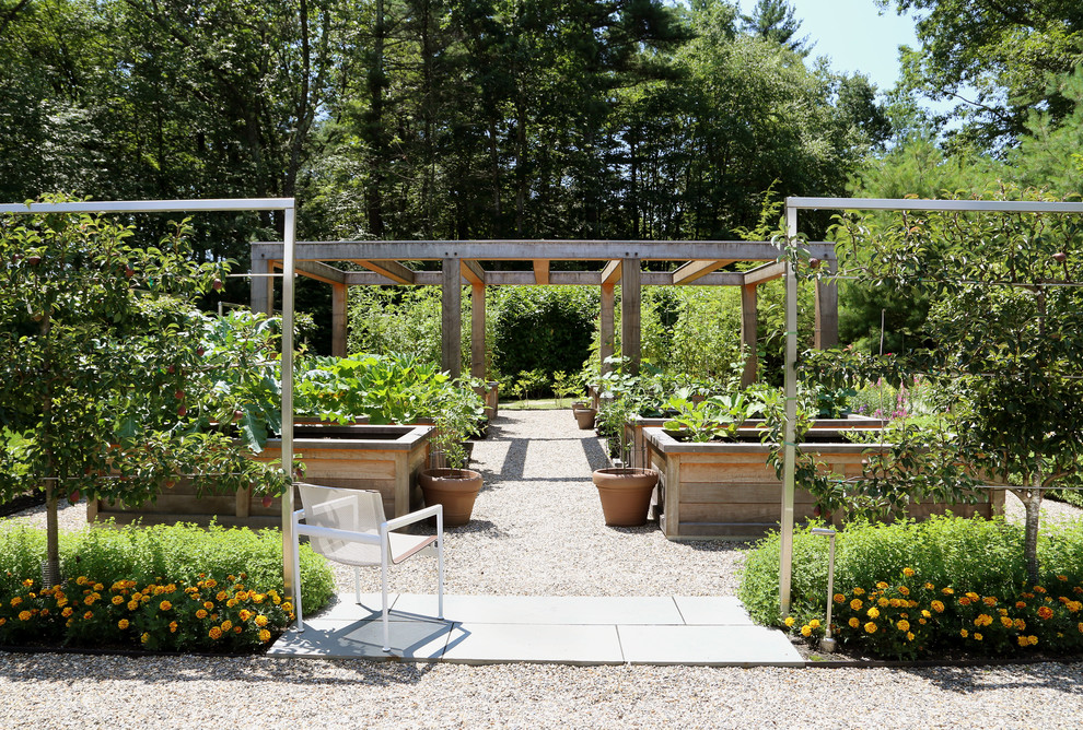 Design ideas for a country backyard full sun formal garden for summer in Boston with a vegetable garden and gravel.