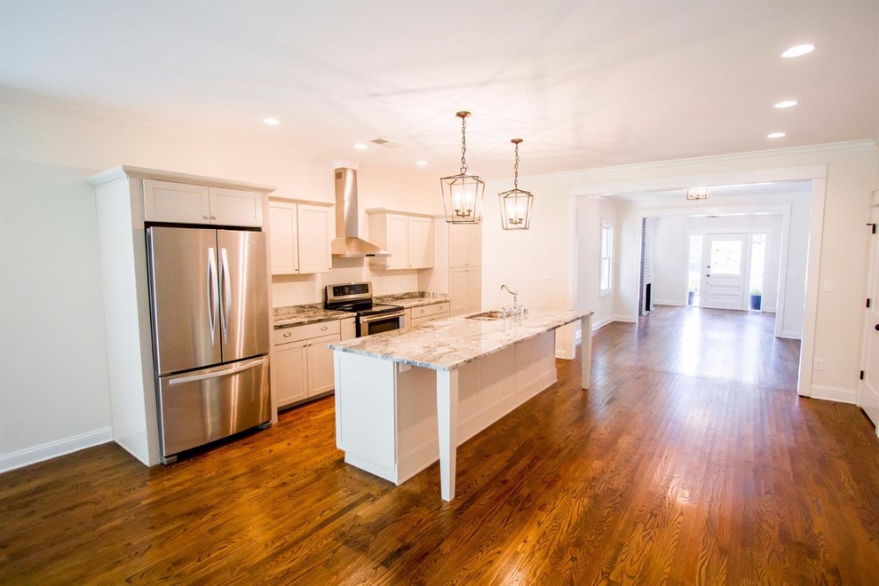 Example of a large transitional single-wall dark wood floor and brown floor enclosed kitchen design with an undermount sink, shaker cabinets, gray cabinets, marble countertops, stainless steel appliances and an island
