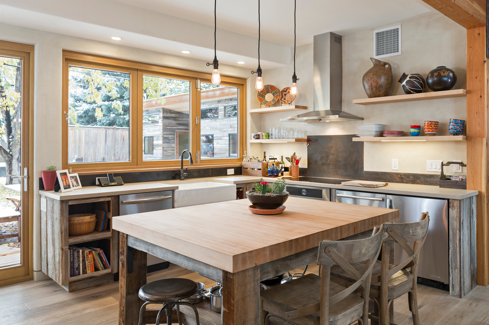 This is an example of a mid-sized u-shaped eat-in kitchen in Denver with a farmhouse sink, open cabinets, distressed cabinets, quartz benchtops, metallic splashback, stainless steel appliances, light hardwood floors, with island, beige floor and grey benchtop.