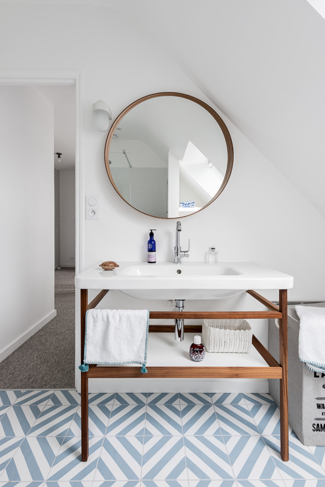 This is an example of a mid-sized contemporary kids bathroom in Other with dark wood cabinets, an open shower, white tile, white walls, ceramic floors, a console sink, blue floor, an open shower and white benchtops.