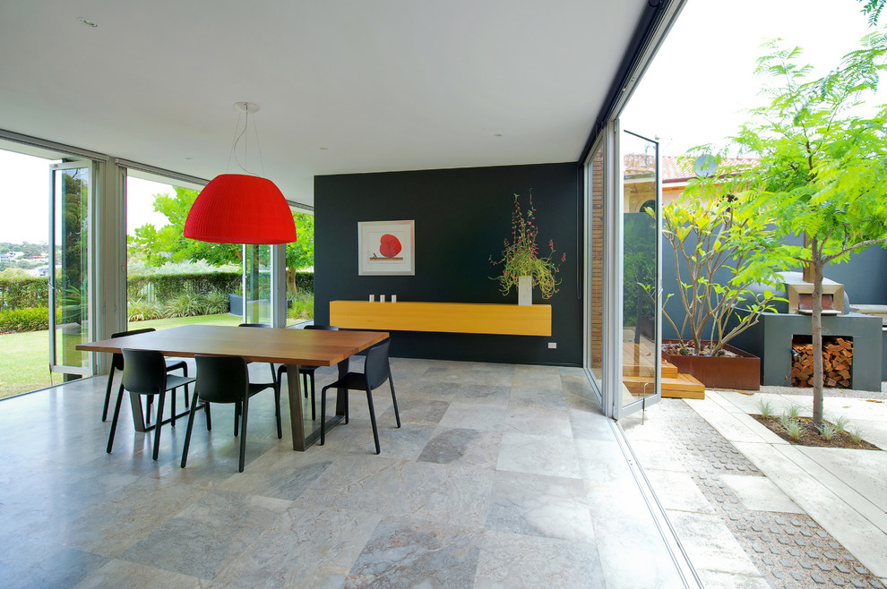 Large contemporary dining room in Perth with black walls.