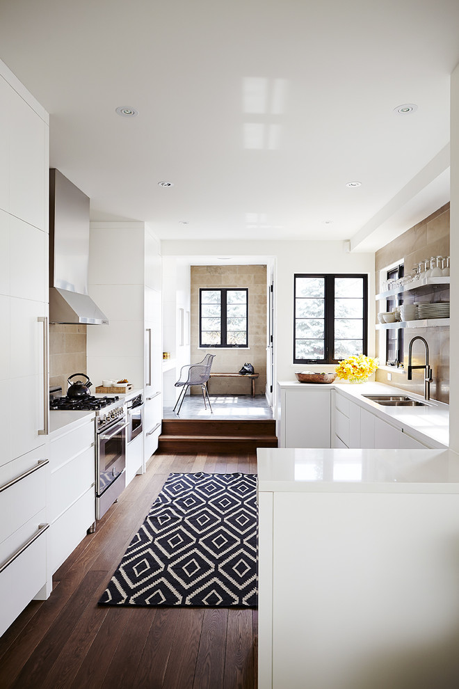 Design ideas for a transitional kitchen in Toronto with an undermount sink, flat-panel cabinets, white cabinets, brown splashback, dark hardwood floors and no island.