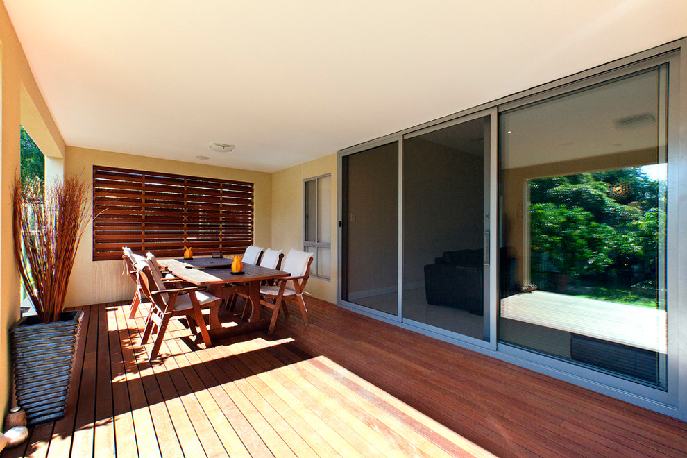 Mid-sized contemporary backyard patio in Adelaide with decking and a roof extension.