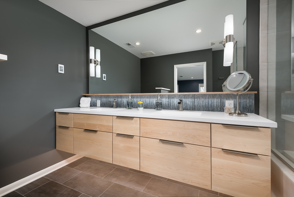 Mid-sized midcentury master bathroom in Other with flat-panel cabinets, light wood cabinets, blue tile, mosaic tile, grey walls, ceramic floors, an integrated sink, solid surface benchtops, brown floor, white benchtops, a double vanity and a floating vanity.