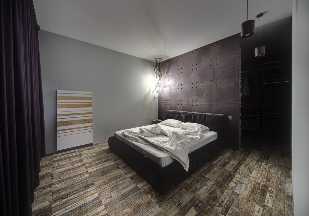Design ideas for an industrial bedroom in Other.