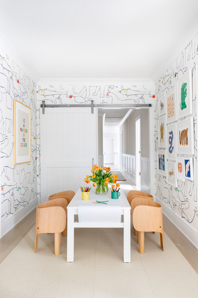 Mid-sized traditional gender-neutral kids' playroom in New York with multi-coloured walls, light hardwood floors and brown floor for kids 4-10 years old.