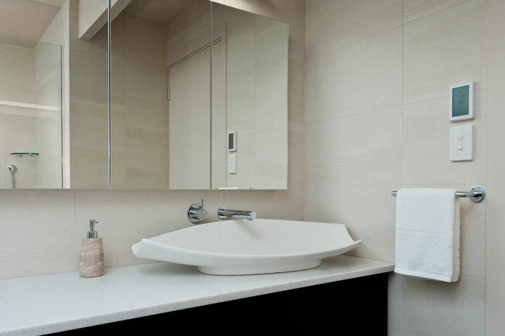 Mid-sized contemporary master bathroom in Other with black cabinets, a drop-in tub, an open shower, a one-piece toilet and beige walls.
