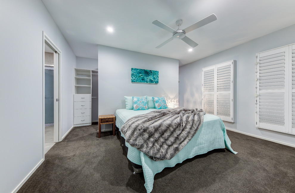 This is an example of a mid-sized contemporary master bedroom in Sunshine Coast with grey walls, carpet and grey floor.