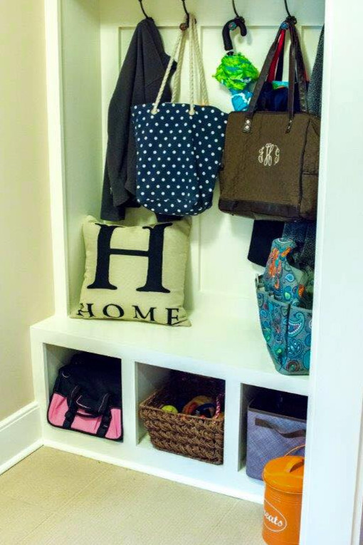 Inspiration for a mid-sized ceramic tile mudroom remodel with beige walls