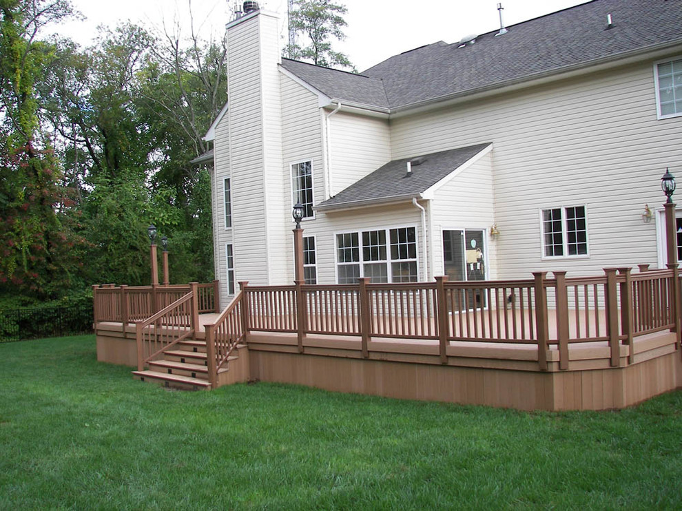Small transitional backyard deck photo