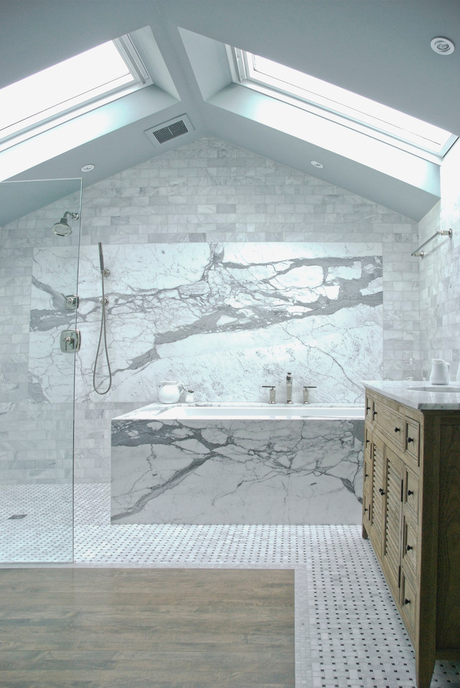 Inspiration for a transitional bathroom in Vancouver with marble benchtops and marble.