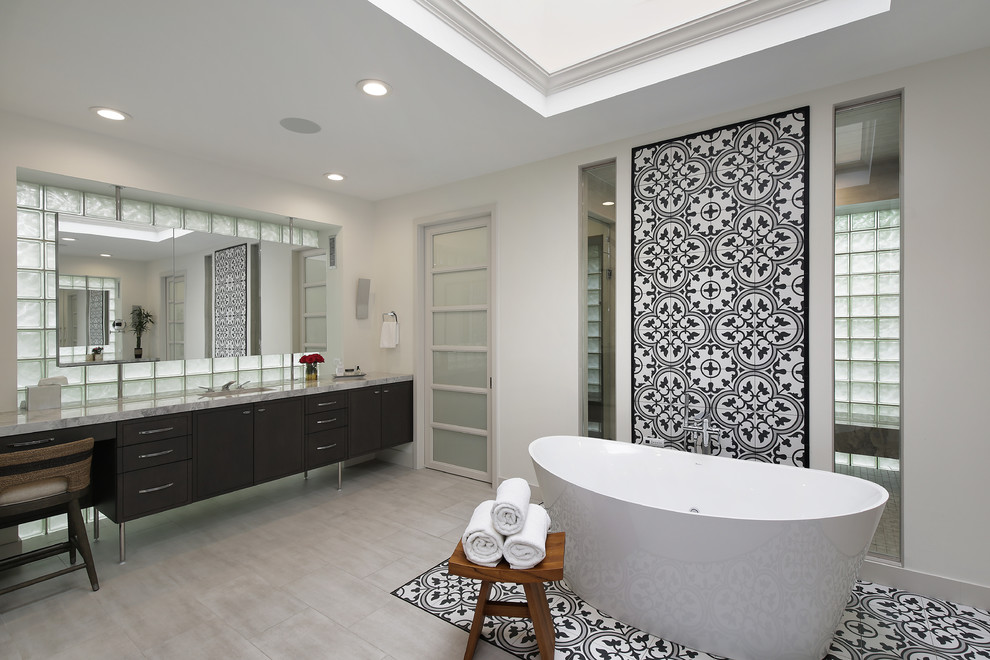 This is an example of an expansive modern master wet room bathroom in Chicago with flat-panel cabinets, brown cabinets, a freestanding tub, an undermount sink, marble benchtops, a hinged shower door and white benchtops.