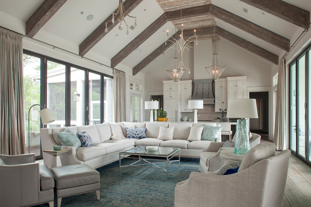 Photo of a beach style formal open concept living room in Other with white walls, painted wood floors and brown floor.