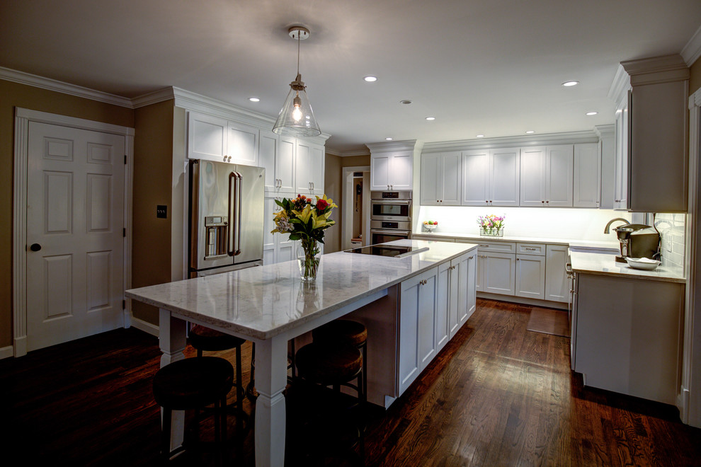 Example of a large transitional medium tone wood floor kitchen design with a farmhouse sink and stainless steel appliances