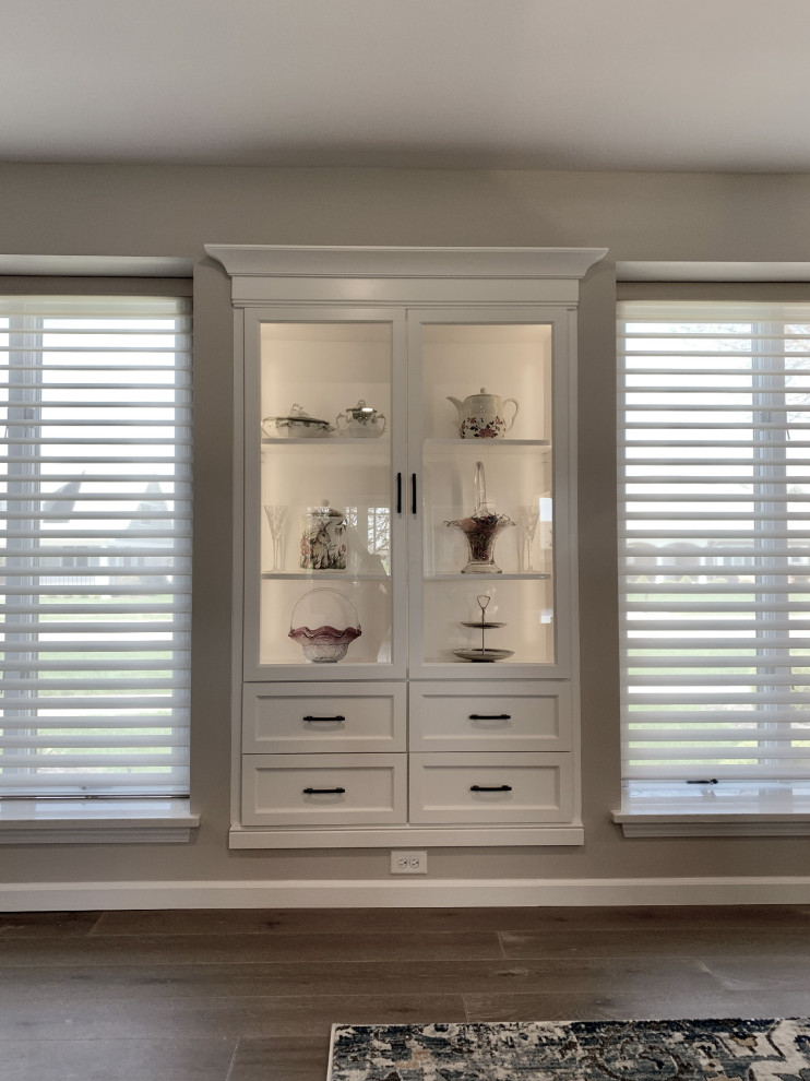 Inspiration for a large transitional l-shaped vinyl floor and gray floor eat-in kitchen remodel with an undermount sink, recessed-panel cabinets, white cabinets, quartz countertops, gray backsplash, ceramic backsplash, stainless steel appliances, an island and white countertops