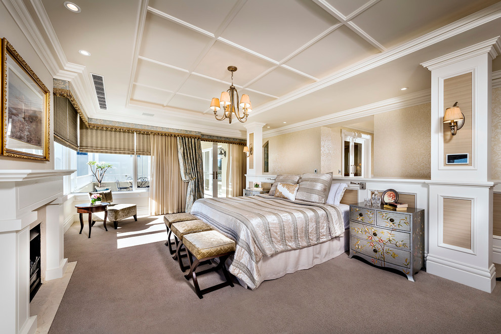 Inspiration for a large traditional master bedroom in Perth with beige walls, carpet and a standard fireplace.